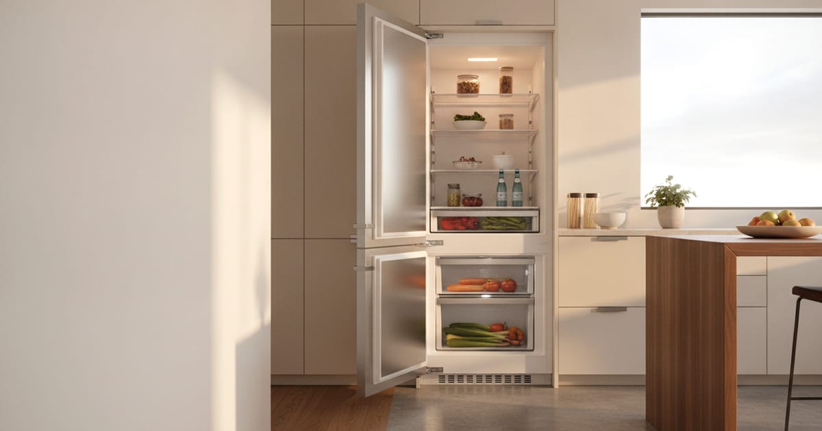 A Sub-Zero built-in refrigerator door open, showing the gasket and interior shelving