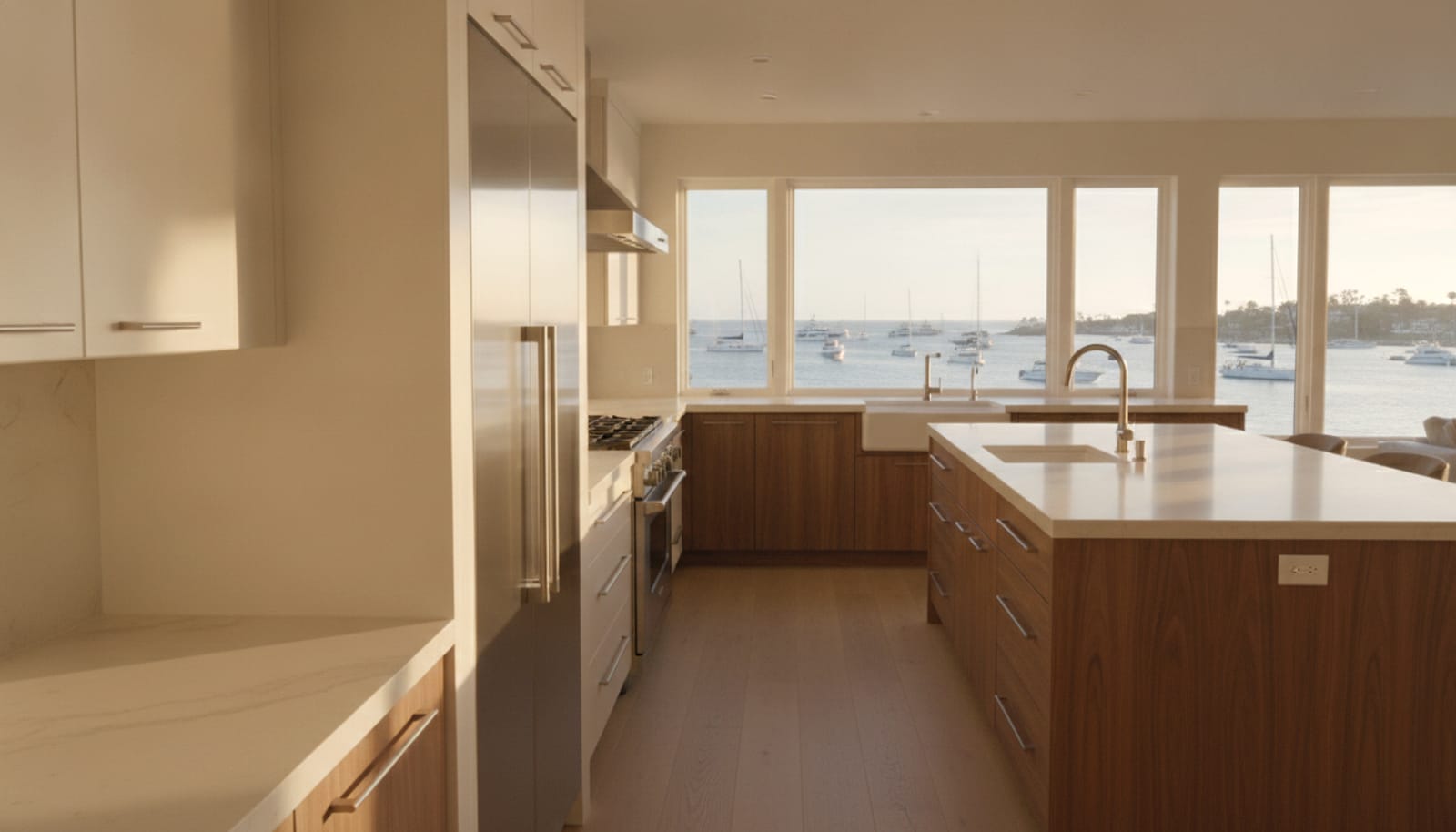Newport Beach waterfront coastal-contemporary kitchen with a built-in refrigerator